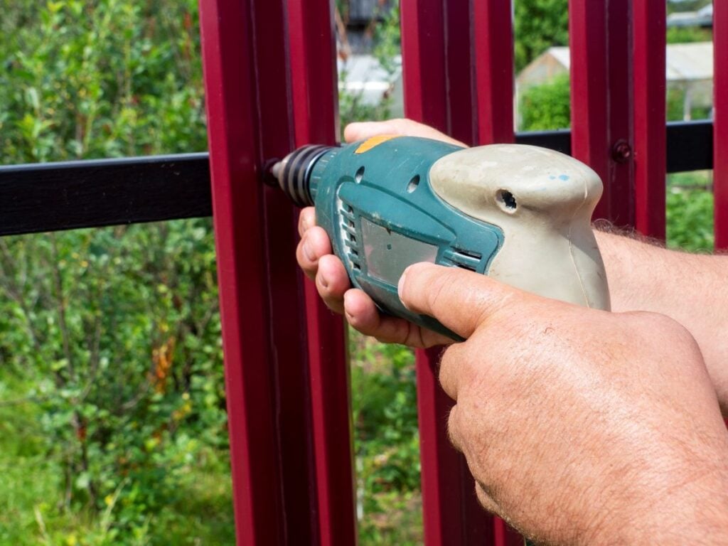 aluminum fence installation workers hands